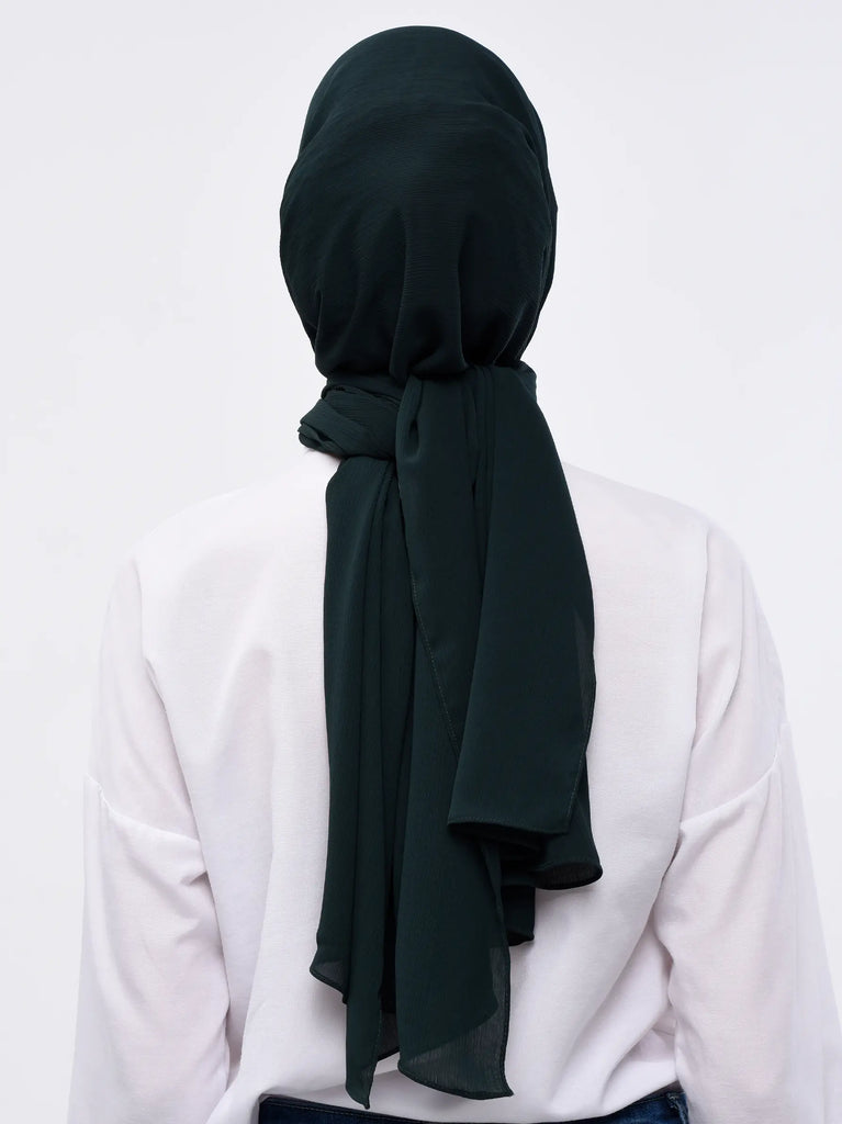 Dark green hijab has been worn by a lady