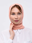 Peach pink scarf has been worn by a lady