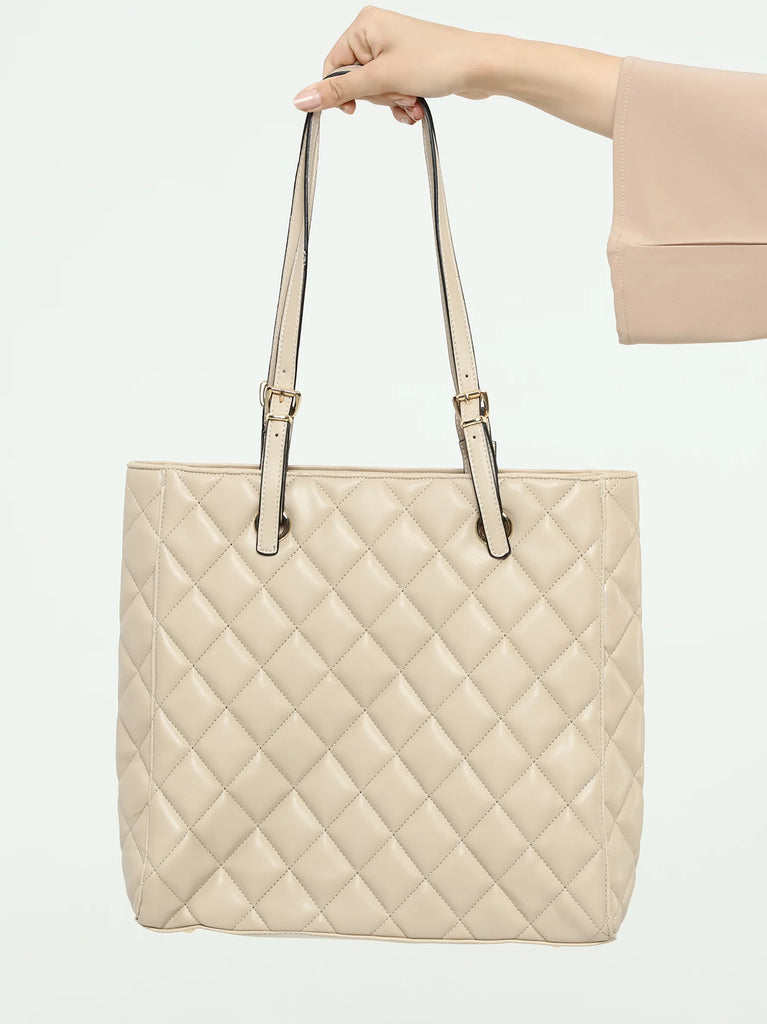 brown quilted bag
